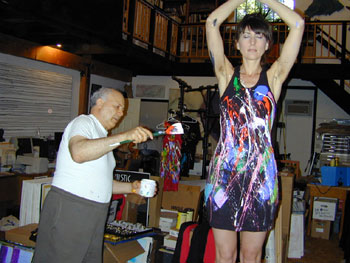 E.J. Gold painting a Galaxy Black Racerback Dress on model Jed-rik