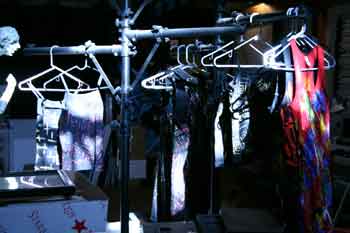 racks of dresses in shadow and sunlight at Tattoo Fashions Studio